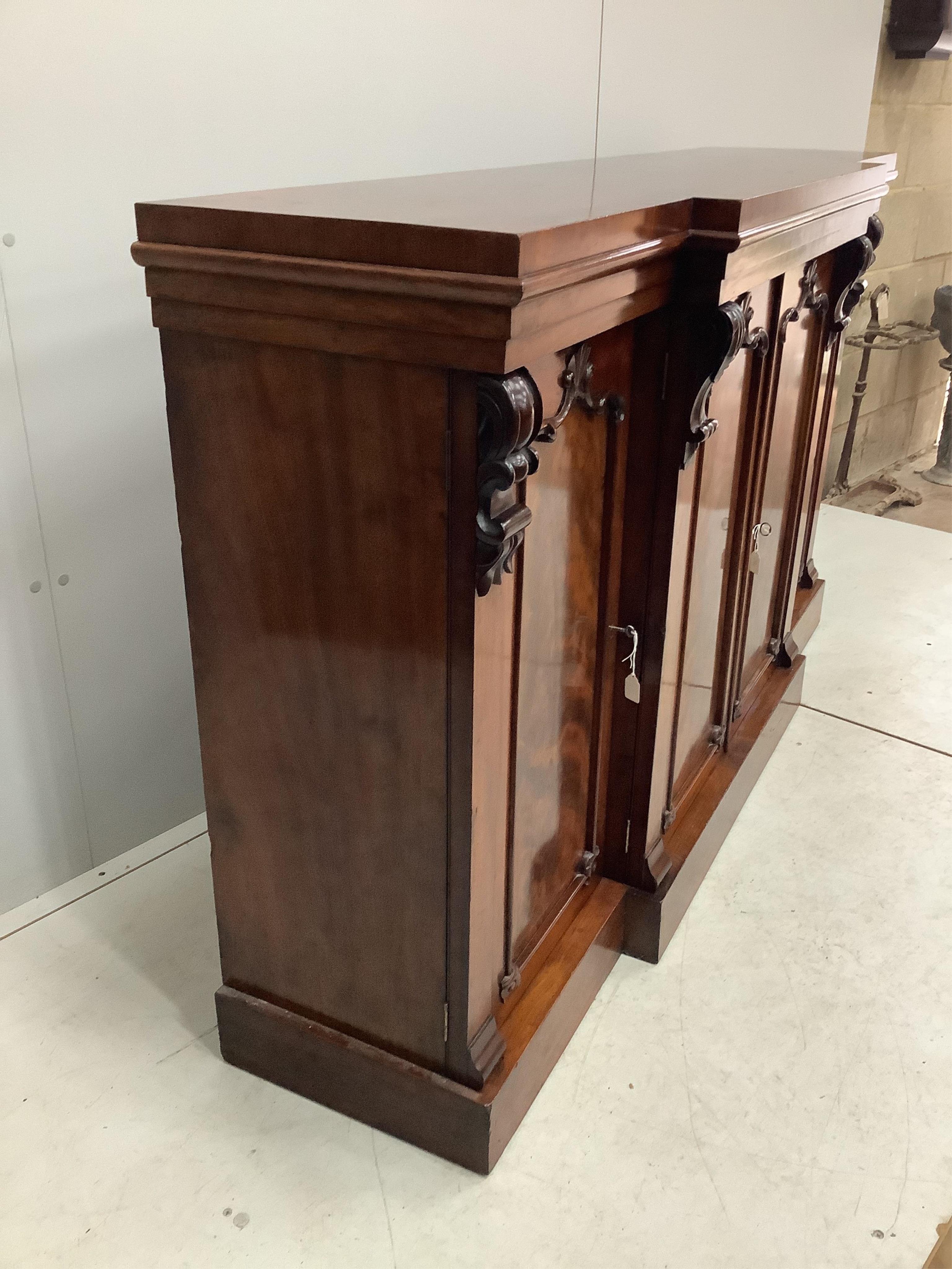 A mahogany breakfront dwarf bookcase, width 170cm, height 99cm. Condition - fair to good